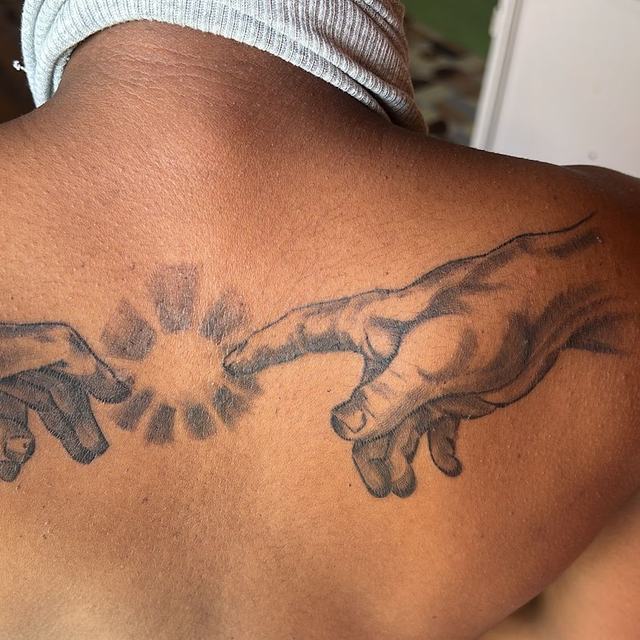 Creation of Adam back tattoo